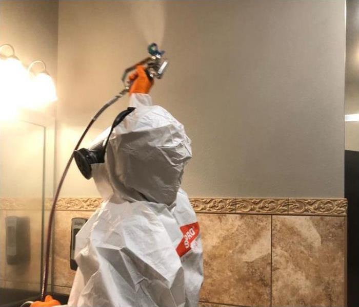 Certified: SERVPRO Cleaned - technician in PPE
